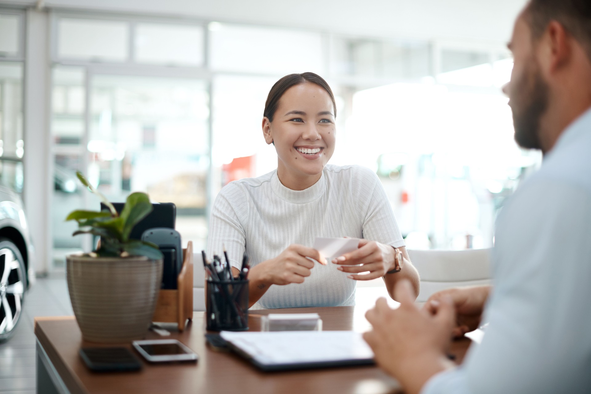 Shot of two businesspeople having a conversation in their office
